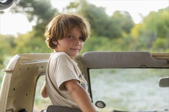 Portrait of Boy in safari vehicle