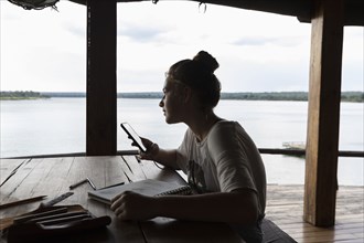 Girl relaxing in lodge by Zambezi River