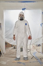House Painter wearing protective suit and mask