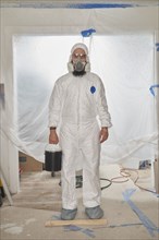 House Painter wearing protective suit and mask