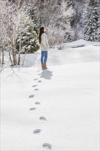 Woman standing in Winter landscape