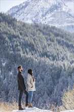Couple looking at view in Winter landscape