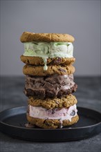 Stack of ice cream sandwiches on plate