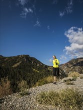 Woman jogging in mountain landscape