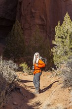 Senior female hiker exploring canyon