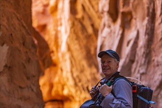 Senior hiker exploring rock formations in Kodachrome Basin State Park near Escalante Grand Staircase National Monument