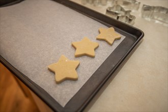 Baking star shaped Christmas cookies