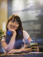 Smiling woman sitting in cafe