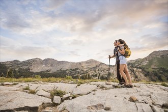 Hiking couple looking at view in mountains