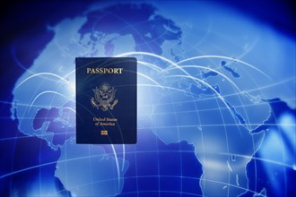 US passport against blue world map
