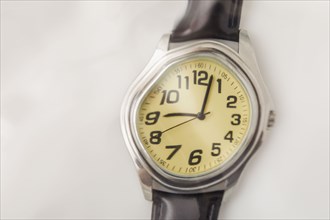 Close-up of distorted wristwatch
