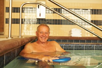 Senior man in hospital pool