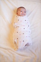 Baby (0-1month) wrapped in blanket