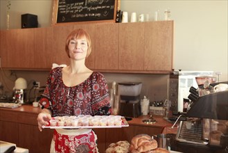 Portrait of woman working in bakery