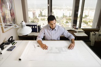 Architect at drafting table