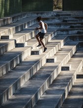 Man jogging up steps