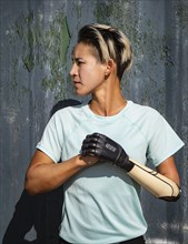Portrait of athletic woman with prosthetic arm
