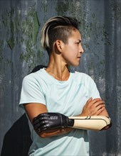 Portrait of athlete woman with prosthetic arm