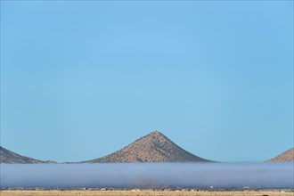 Fog above desert landscape in Cerrillos Hills State Park