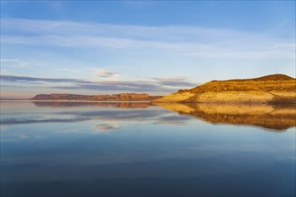 Rock formations reflected in water in Elephant Butte Lake State Park