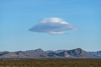 Lenticular cloud over landscape