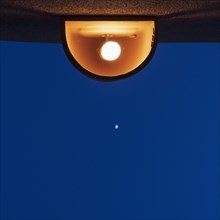 Lamp against sky at night