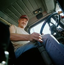 Portrait of happy truck driver
