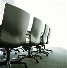 Empty boardroom with black chairs