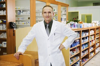 Portrait of male pharmacist in pharmacy