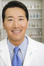 Portrait of male pharmacist in pharmacy
