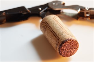 Close-up of corkscrew with wine cork