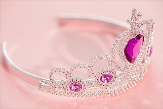 Studio shot of tiara with artificial pink gemstones