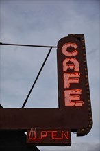 Low angle view of cafe neon sign on Route 66