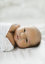 Portrait of swaddled newborn boy