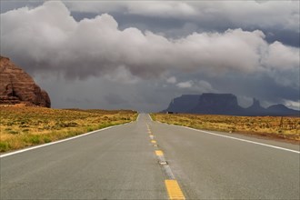 Storm clouds above desert road