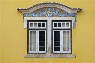 Yellow building with traditional tile work