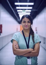 Portrait of smiling female technician in data center