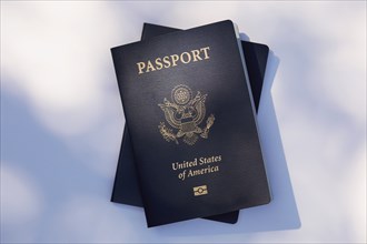 Two American passports on white background
