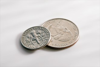 Two US coins on white background