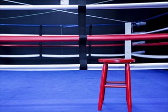 Red stool in boxing ring