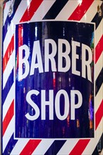 Close-up of barber shop sign