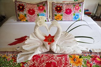 Romantic bed decor with towel swans
