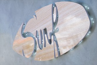 Close-up of wooden surfing sign