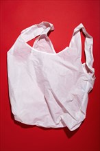 Reusable shopping bag against red background