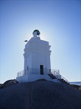 White lighthouse on sea coast