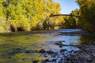 Big Wood River in fall with view of Bow Bridge