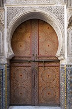 Traditionally decorated doors and tilework of mosque