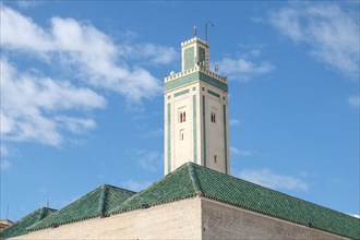 Tower and green tiled roof of mosque