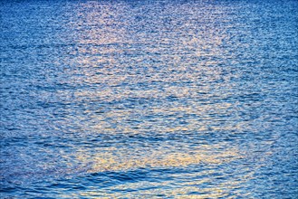 Calm ocean surface reflecting sunlight