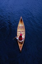 Overhead view of woman paddling canoe on Lake Placid
